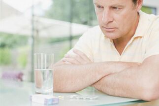 A man takes pills after 50 to increase potency